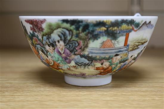 A Chinese porcelain bowl, painted with infants in a landscape, diam. 13.5cm